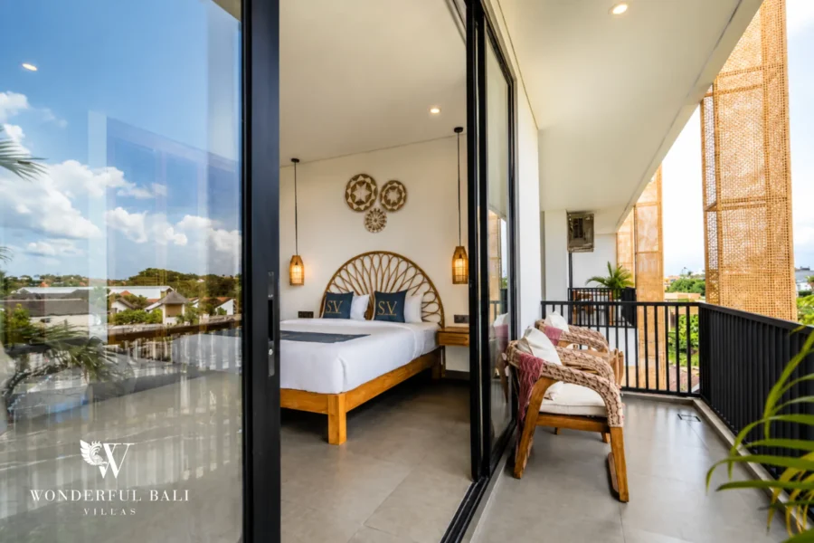 Bedroom opening to a private balcony with view, 1-bedroom modern studio apartment in Canggu, Bali