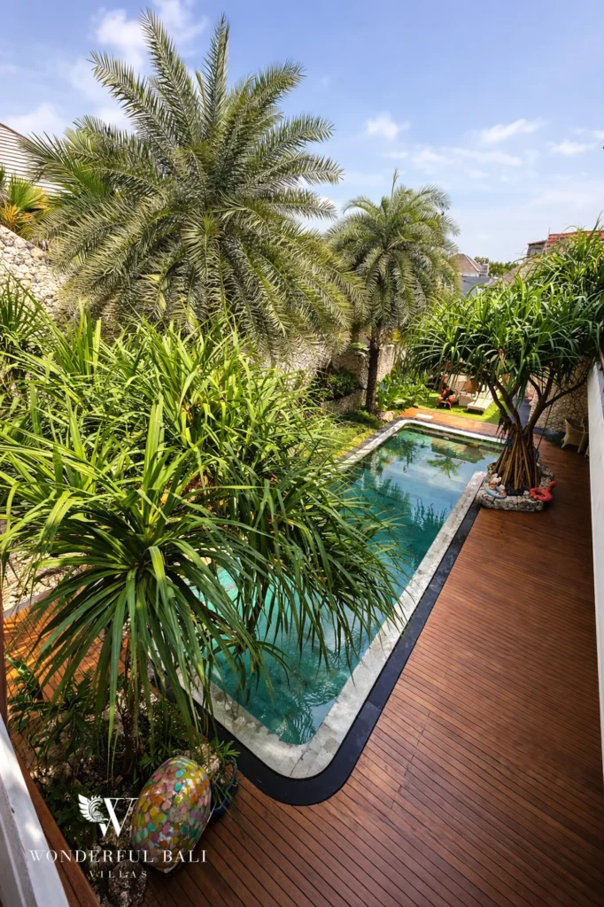 Exterior overview of a four-bedroom freehold family villa with large pool in Bumbak, Umalas, Bali