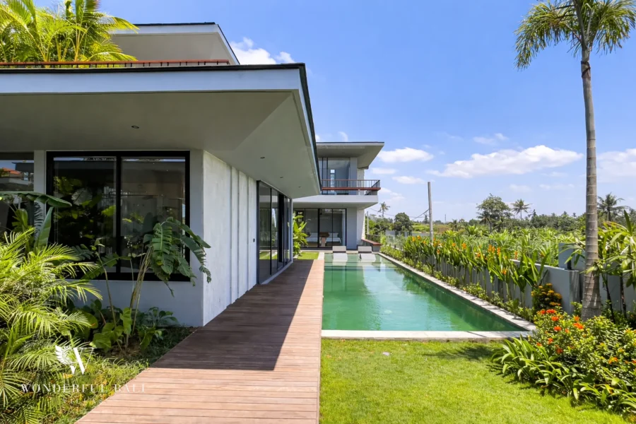 Exterior overview of a modern four-bedroom villa with rice field and volcano views in Pererenan, Bali