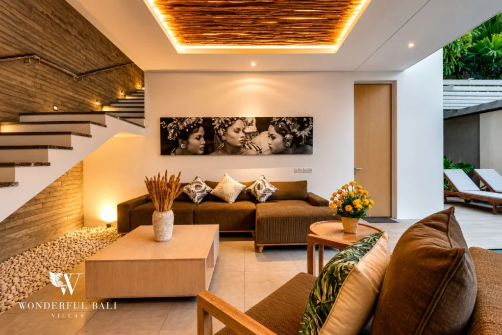 Open living room with stone feature wall at a villa in Petitenget, Bali