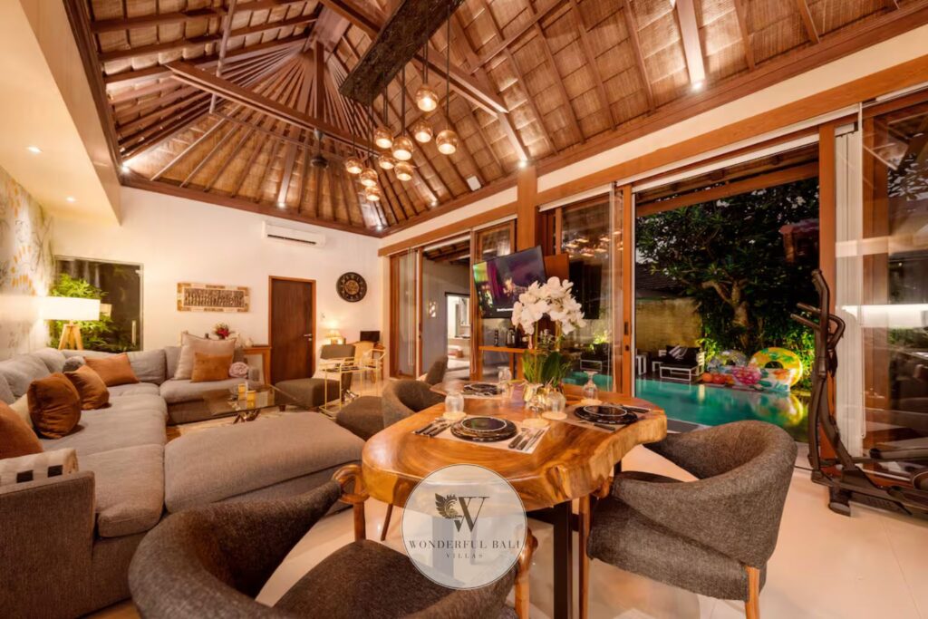 Open-plan living room with direct pool access at luxury villa for sale, Seminyak Bali