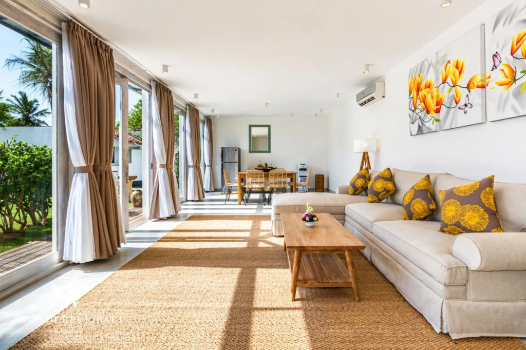 Second indoor living area with rattan rug and daybed, Villa Hasian — 5-bedroom villa in Jimbaran