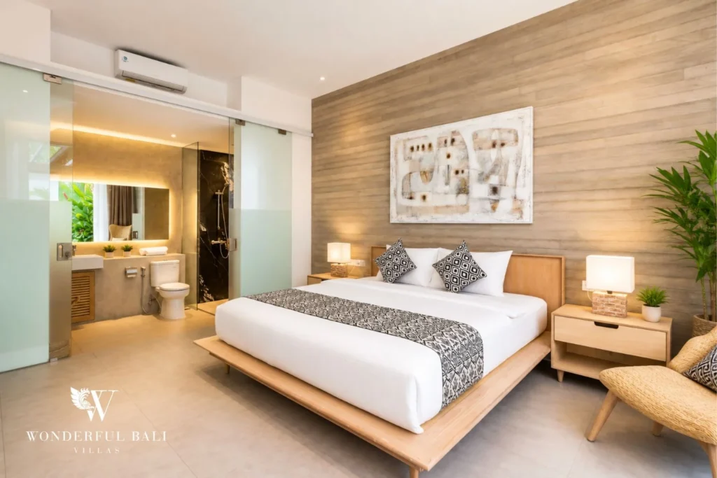 Bedroom with timber feature wall at a villa in Petitenget, Bali