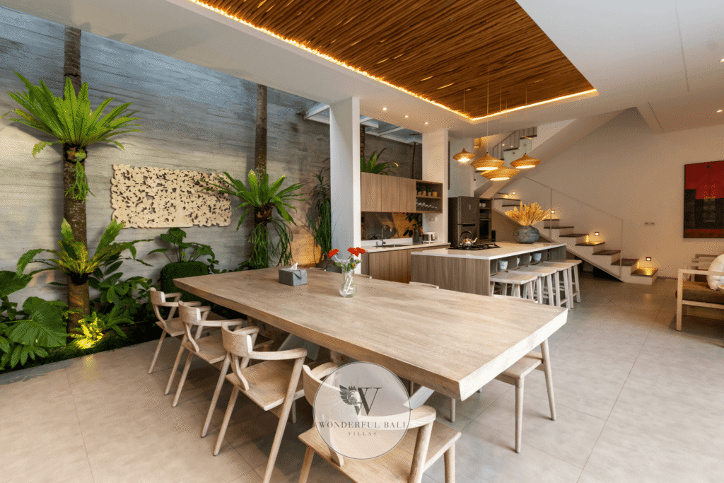 Swan Tiga – Elegant indoor dining area with high ceilings and warm ambience – Seminyak, Bali