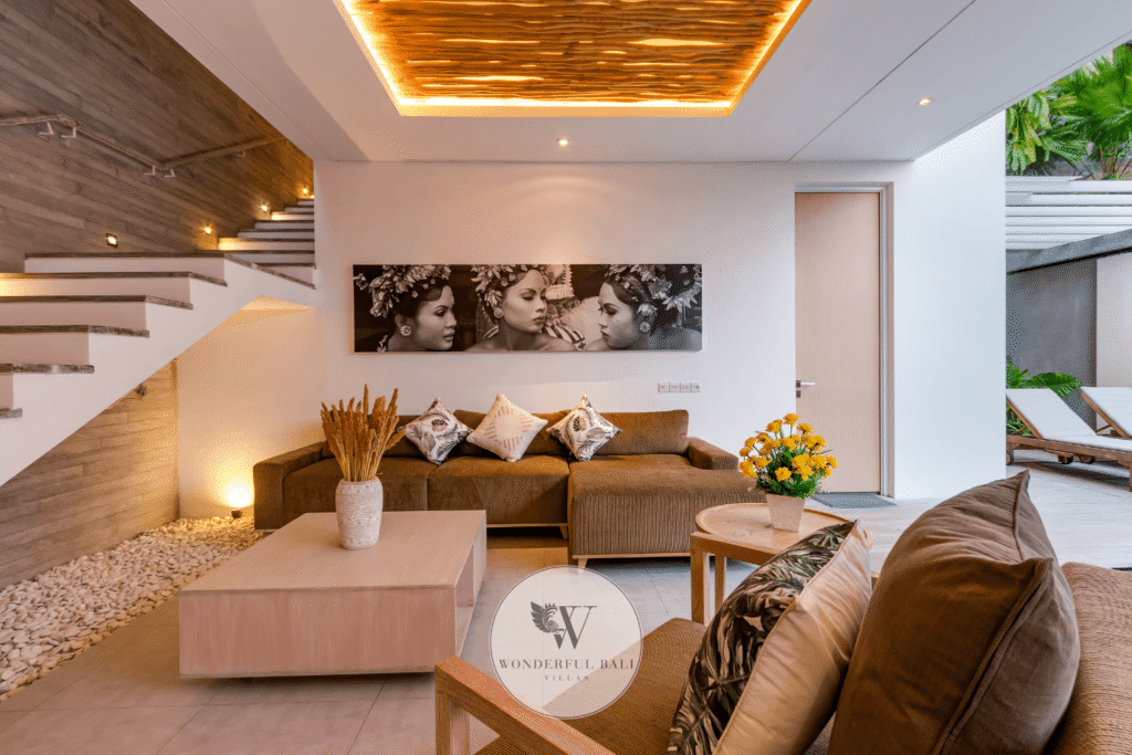 Swan Satu – Living room with warm evening lighting and lush garden views – Seminyak, Bali