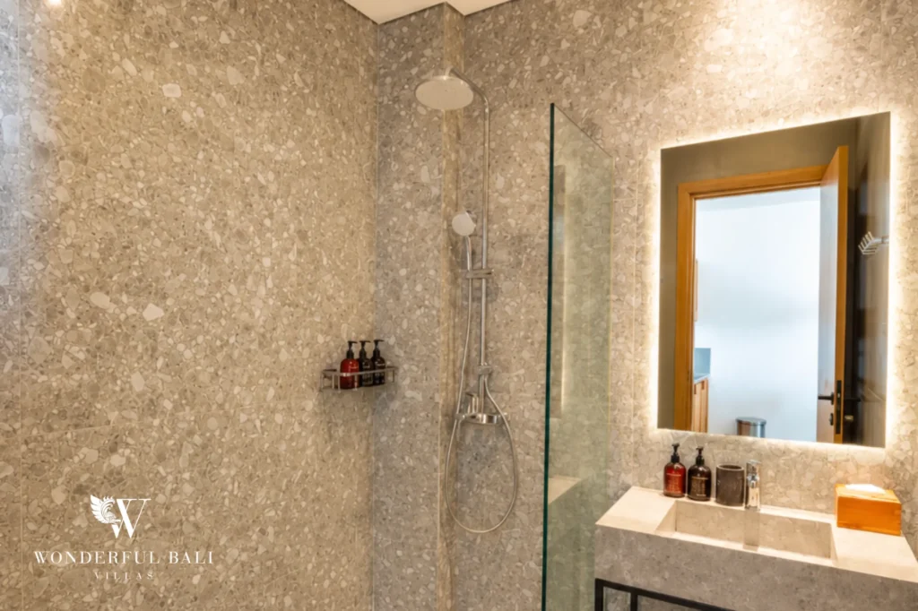 Bathroom with walk-in shower and large mirror, 1-bedroom modern studio apartment in Canggu, Bali