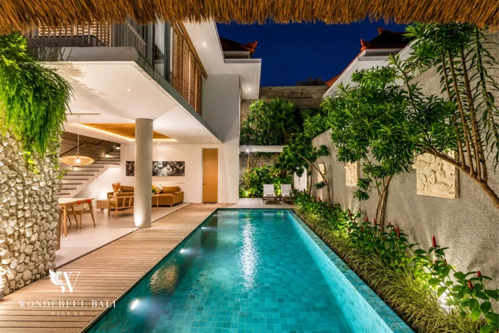 Pool with bale and tropical garden at a villa in Petitenget, Bali