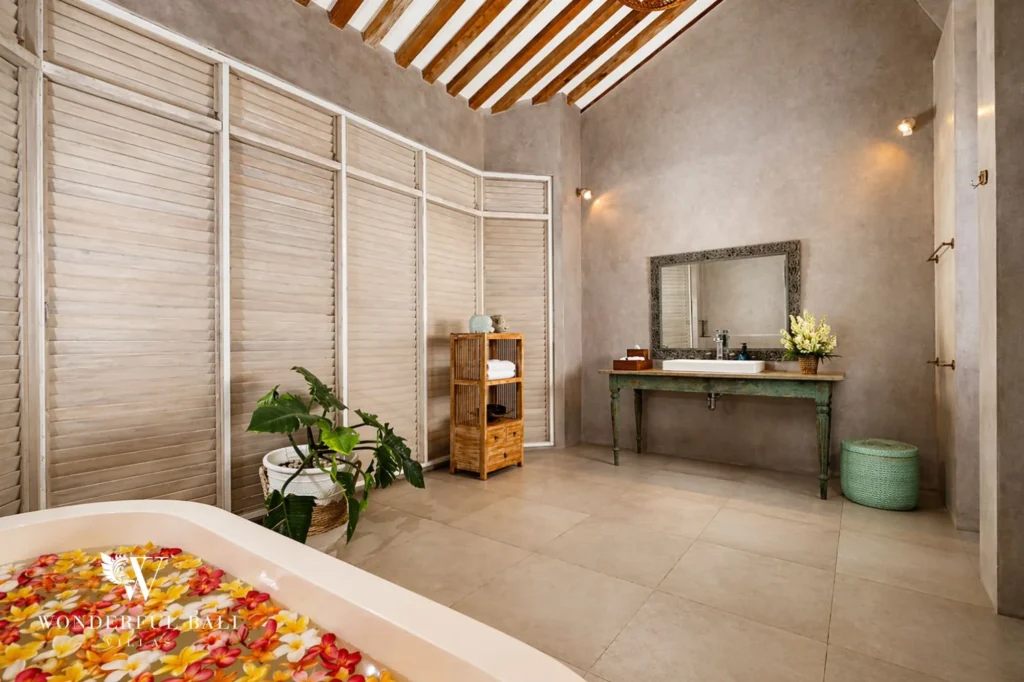 Bathroom with flower-petal bathtub and antique vanity in Balinese style, Villa Hasian in Jimbaran