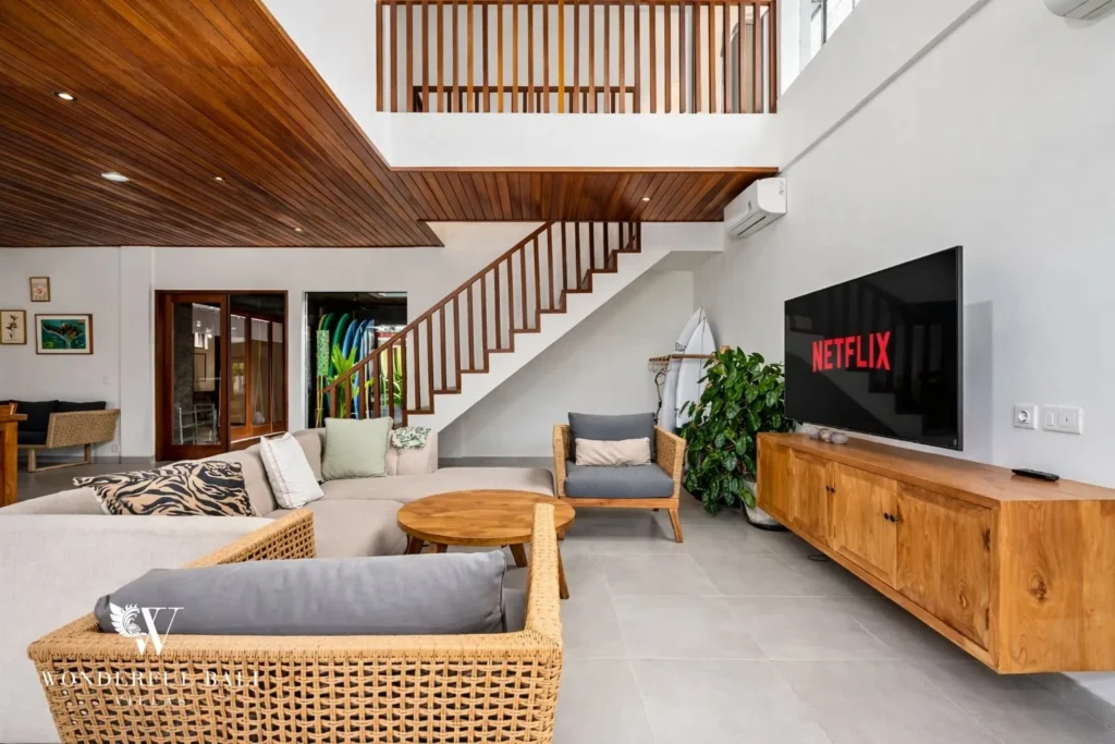 monthly villa rental umalas — living area with staircase and smart tv
