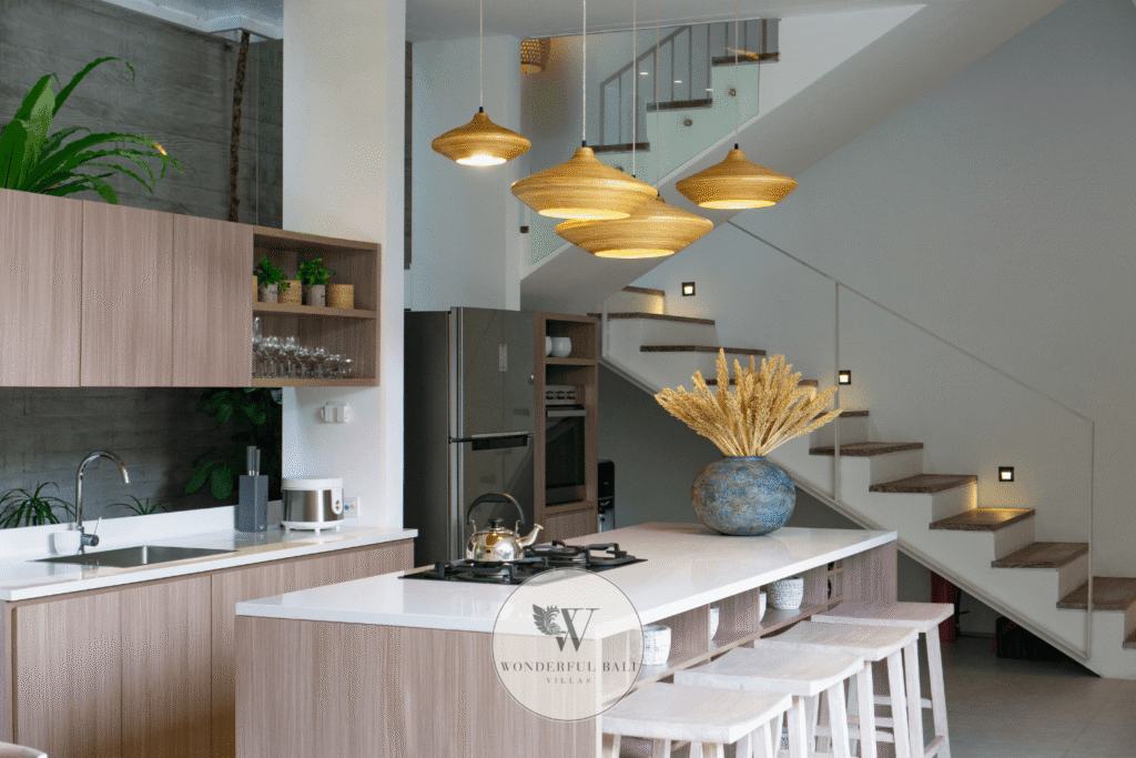 Swan Tiga – Modern kitchen with staircase leading to upper level living – Seminyak, Bali