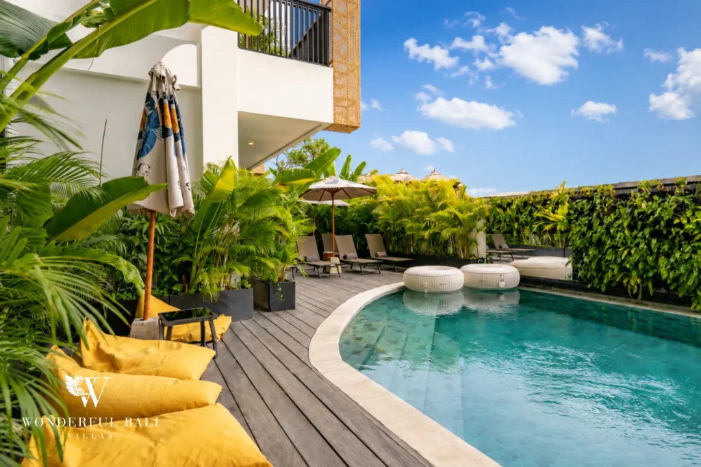 Aerial view of the shared pool with sun loungers, modern serviced apartment in Canggu, Bali