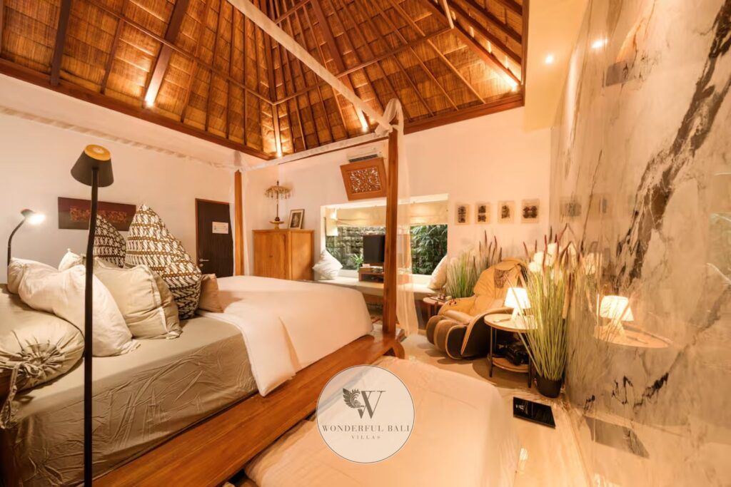 Master bedroom with smart TV and sitting area in ultra-deluxe spa villa, Seminyak Bali