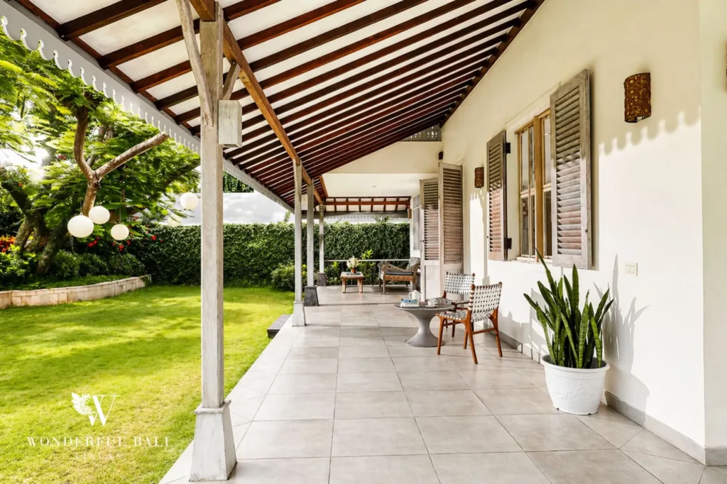 Covered terrace with seating area overlooking the garden, Villa Hasian — 5-bedroom villa in Jimbaran