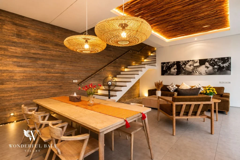 Dining area with staircase and pendant lights at a villa in Petitenget, Bali