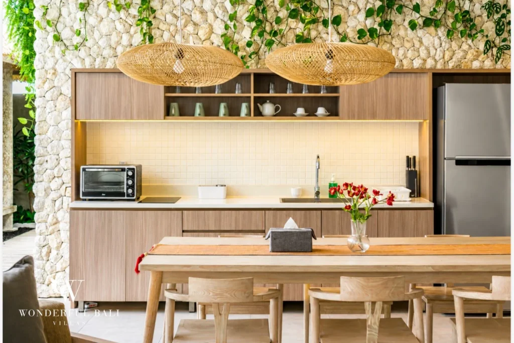 Open kitchen and dining with breakfast bar at a villa in Petitenget, Bali