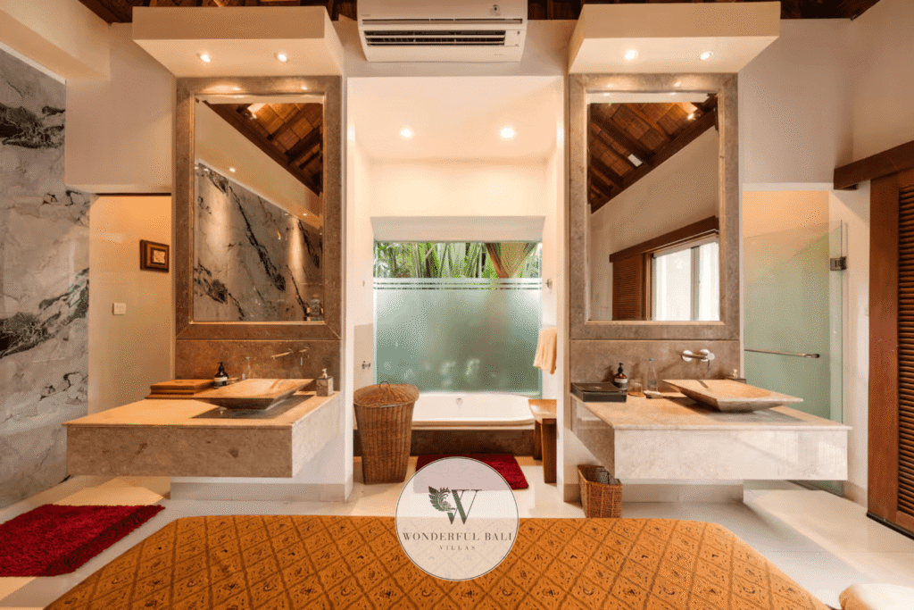 Luxury en-suite bathroom with natural stone finishes in spa villa for sale, Seminyak Bali