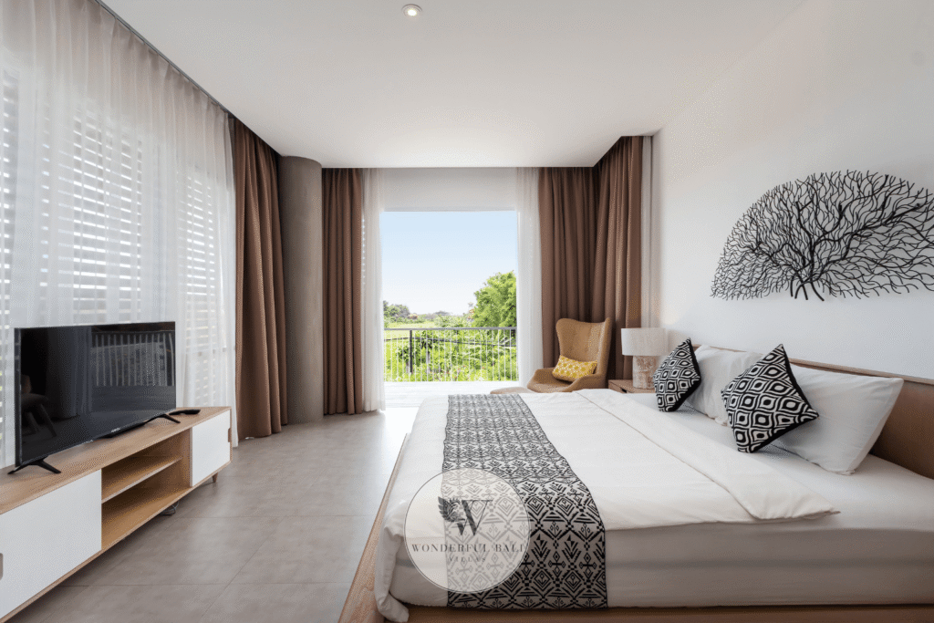 Swan Satu – King master bedroom with wall-mounted TV and tropical outlook – Seminyak, Bali
