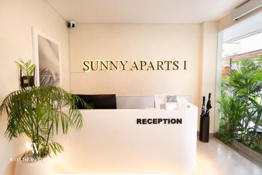 Reception and front-desk area of a modern serviced apartment building in Canggu, Bali