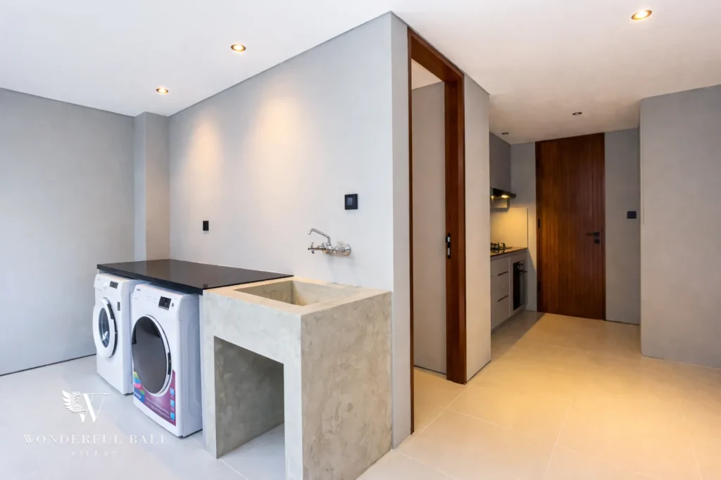 Dedicated utility room with washing machine and storage, Pererenan villa