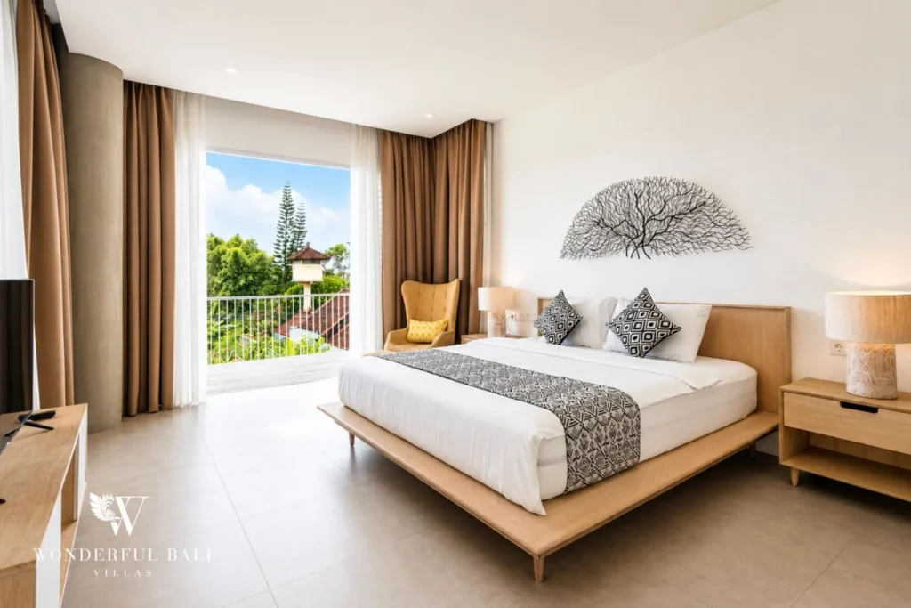 Bedroom with garden-view window at a villa in Petitenget, Bali
