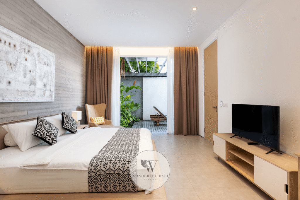 Swan Satu – Bright second bedroom with built-in wardrobe and natural light – Seminyak, Bali