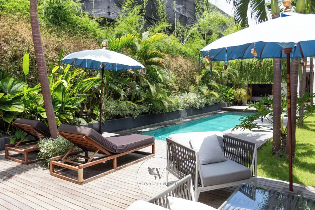 Private outdoor pool surrounded by tropical planting, Umalas villa