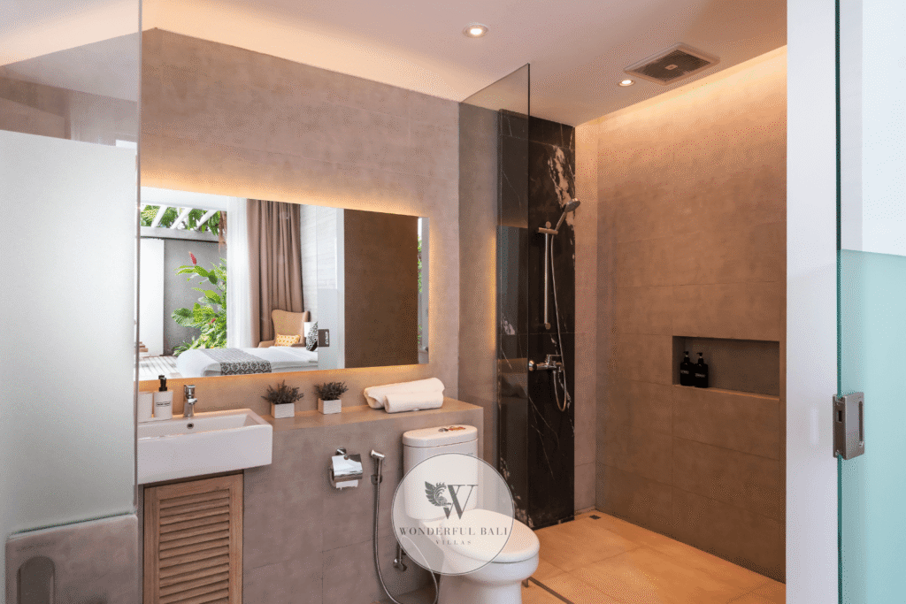 Swan Satu – Contemporary second bathroom with walk-in shower and stone tile – Seminyak, Bali