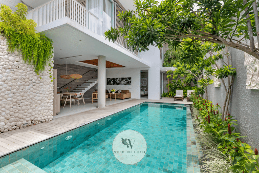 Swan Satu – Outdoor pool terrace and tropical garden in daytime sunlight – Seminyak, Bali