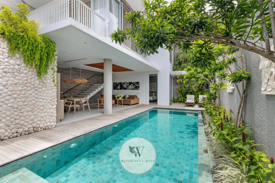 Swan Satu – Outdoor pool terrace and tropical garden in daytime sunlight – Seminyak, Bali