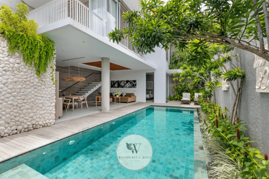 Swan Satu – Outdoor pool terrace and tropical garden in daytime sunlight – Seminyak, Bali