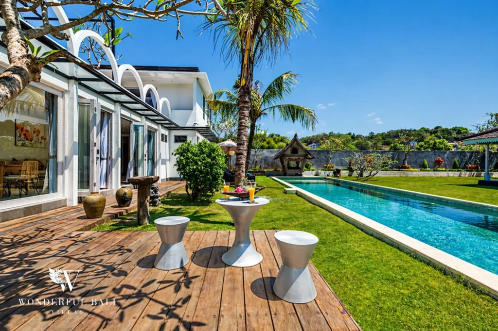 Pool deck with cocktail tables and view across to the pool, Villa Hasian in Jimbaran