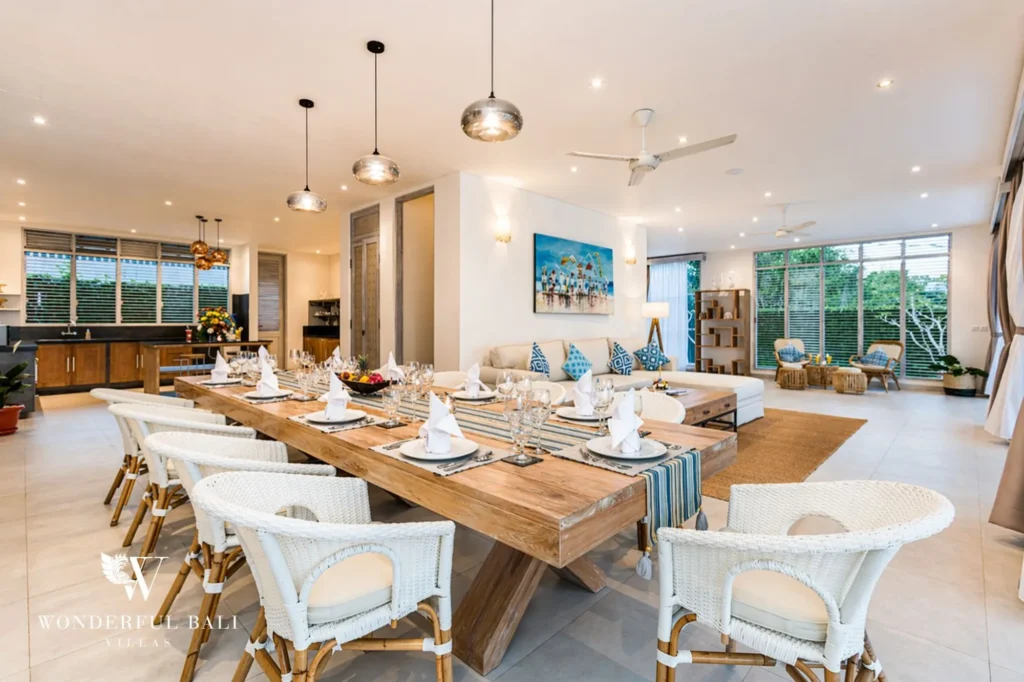 Large combined dining and living area with long table and sofas, Villa Hasian in Jimbaran