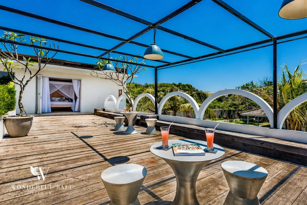 Rooftop lounge under a pergola with seating and drinks, Villa Hasian — 5-bedroom villa in Jimbaran
