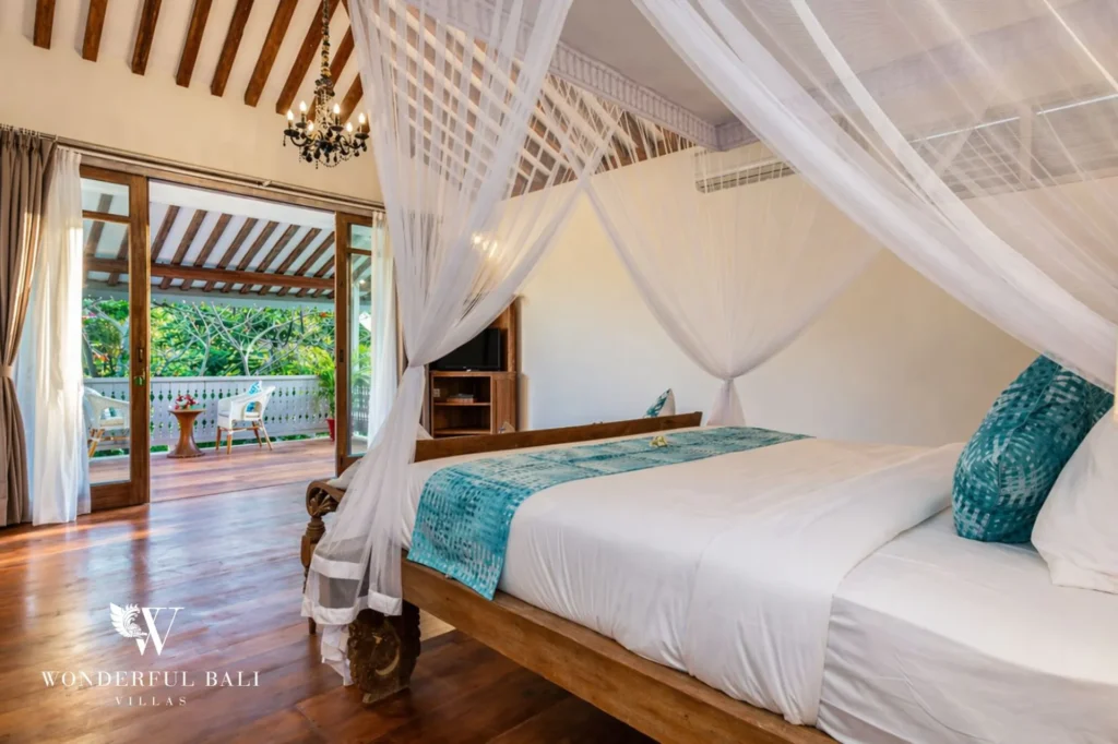 Canopy bedroom opening to a private balcony over the garden, Villa Hasian in Jimbaran