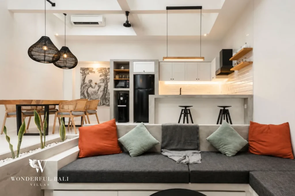 Open-plan living room with 4.5 m ceiling and concrete finishes, 2-bedroom villa in Canggu