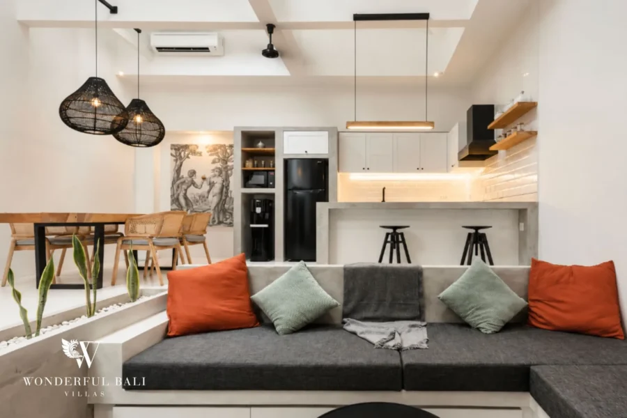 Open-plan living room with 4.5 m ceiling and concrete finishes, 2-bedroom villa in Canggu