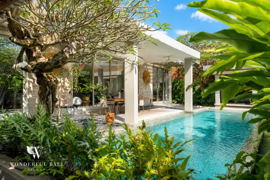 monthly villa rental Umalas — 12m natural-stone pool framed by mature tropical garden in Tegal Cupek