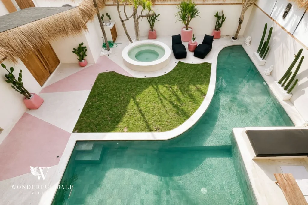 Aerial view of the private pool, jacuzzi and pink terrazzo deck in Berawa, Bali