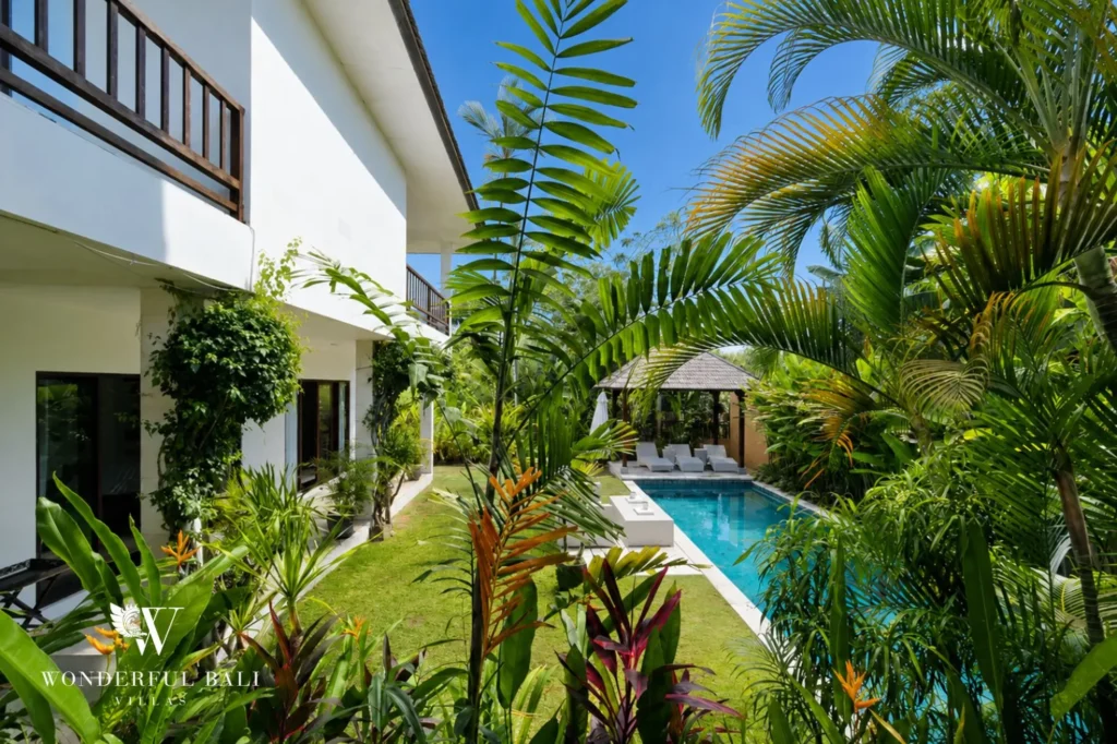 Tropical garden alongside private pool, 4-bedroom villa in Berawa, Canggu