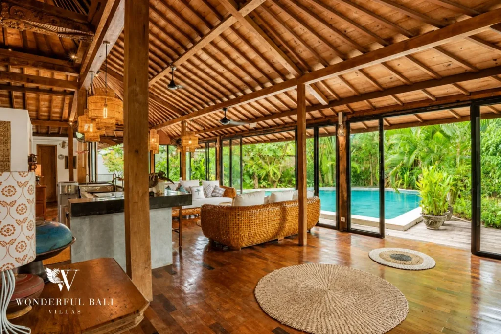 Open-air joglo living area with daybed and high traditional roof, 4-bedroom villa in Umalas