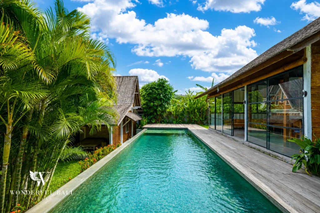 Pool framed by the tropical garden, 4-bedroom dual-villa compound for sale in Pererenan