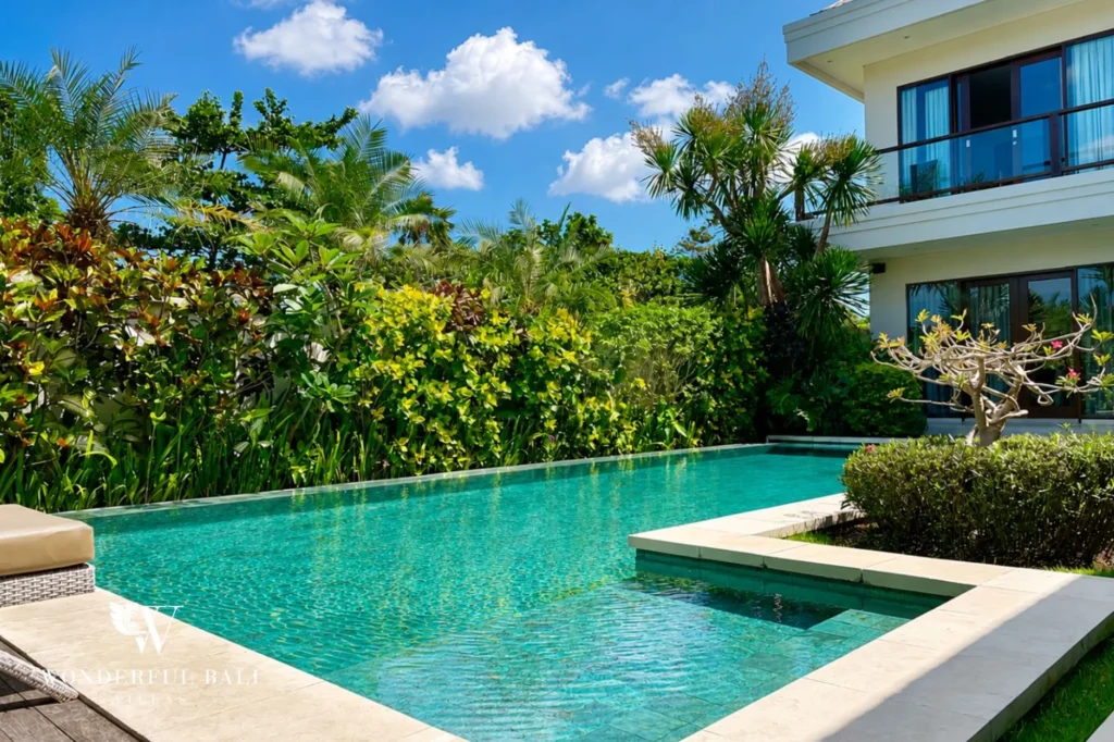 Private pool framed by tropical garden, 5-bedroom villa in Batu Bolong, Canggu