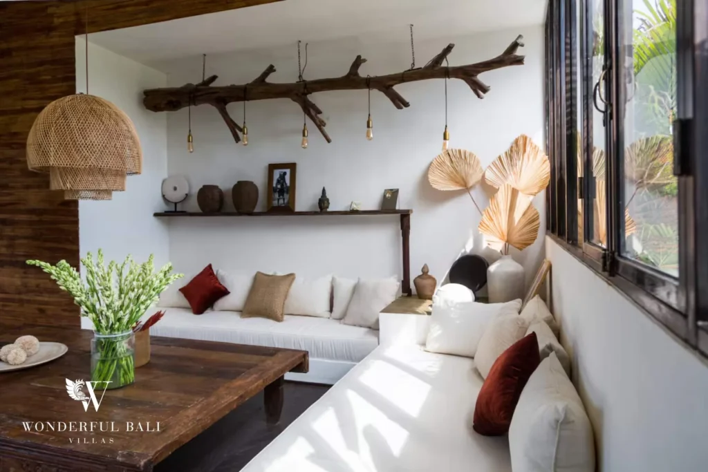 Cozy living lounge with driftwood pendant lights and white sofas in Umalas, Bali