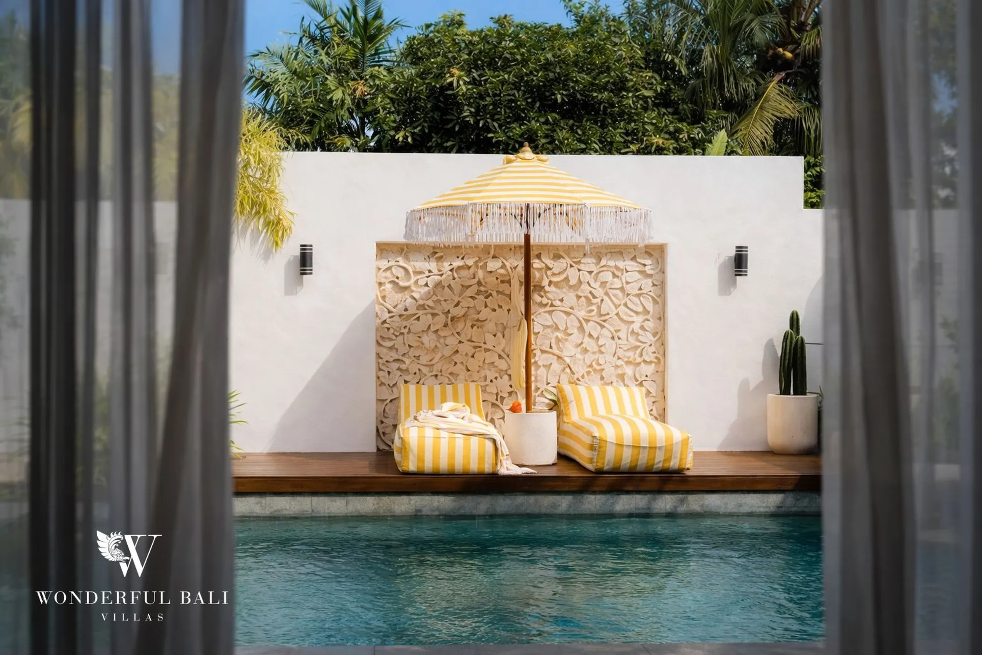 Poolside daybed lounge at a Bali villa
