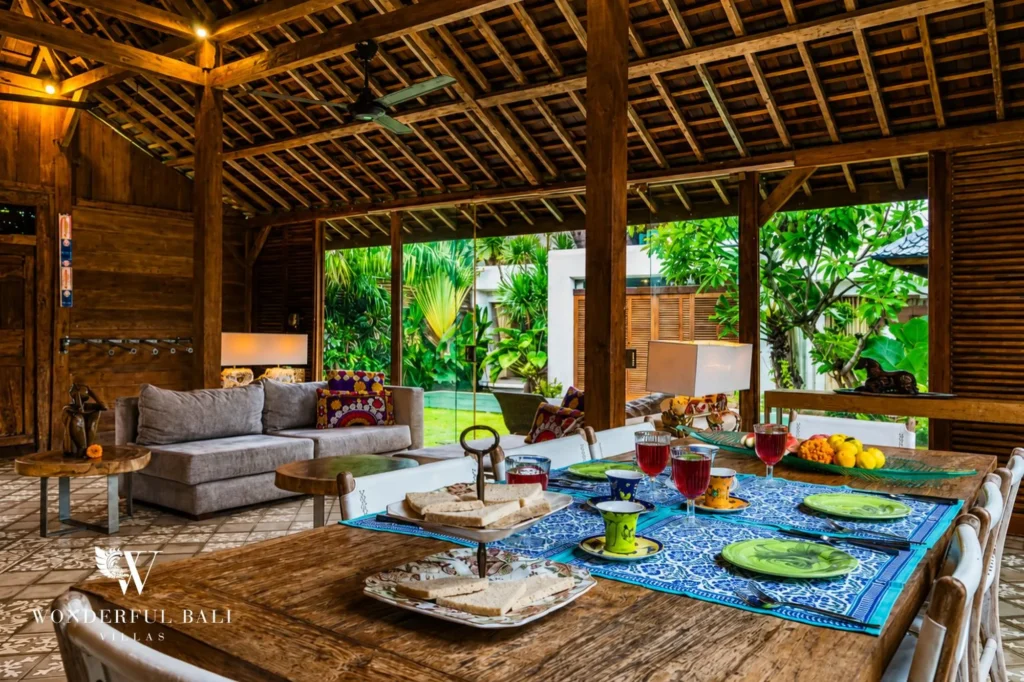 Living room with full-height doors opening onto the pool, 4-bedroom villa in Petitenget, Seminyak