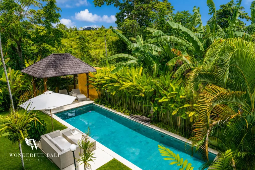View of the pool from inside the garden, 4-bedroom villa in Berawa, Canggu