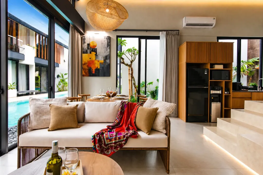 Living area with large sofa and flat-screen TV, Villa Umahan Sanur 3BR Family villa