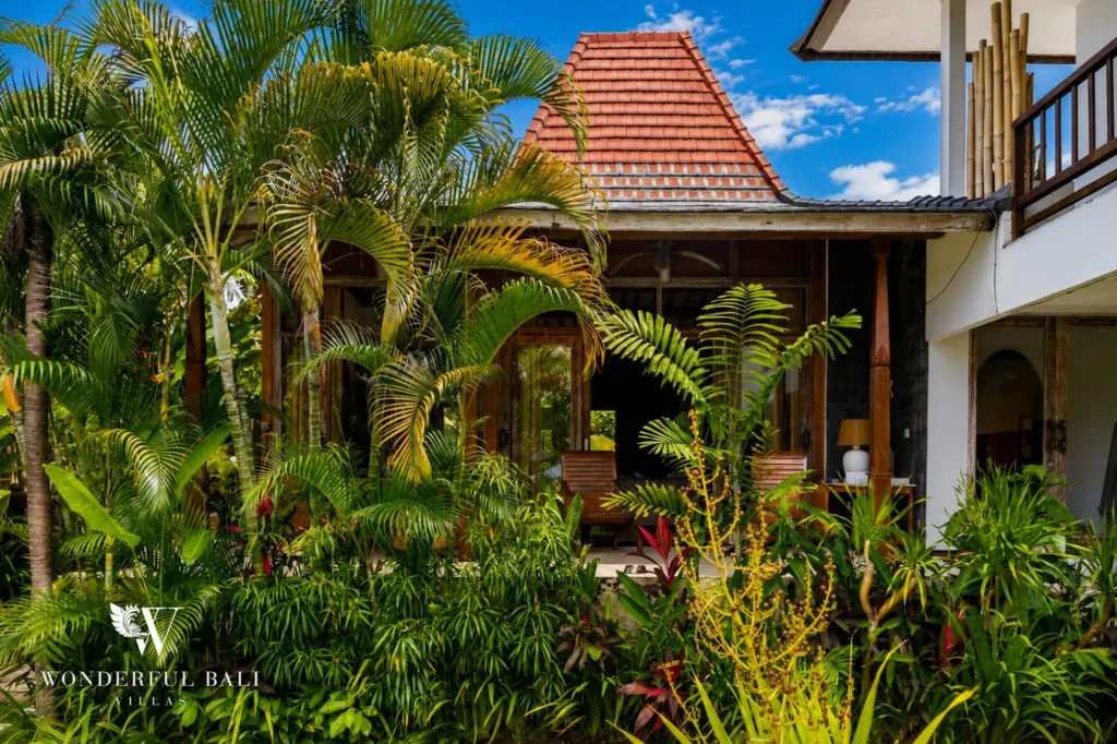 Lush tropical garden surrounding the villa, 4-bedroom property in Berawa, Canggu