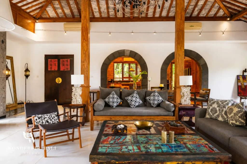 Enclosed living room under a traditional alang-alang roof, 4-bedroom villa in Berawa, Canggu