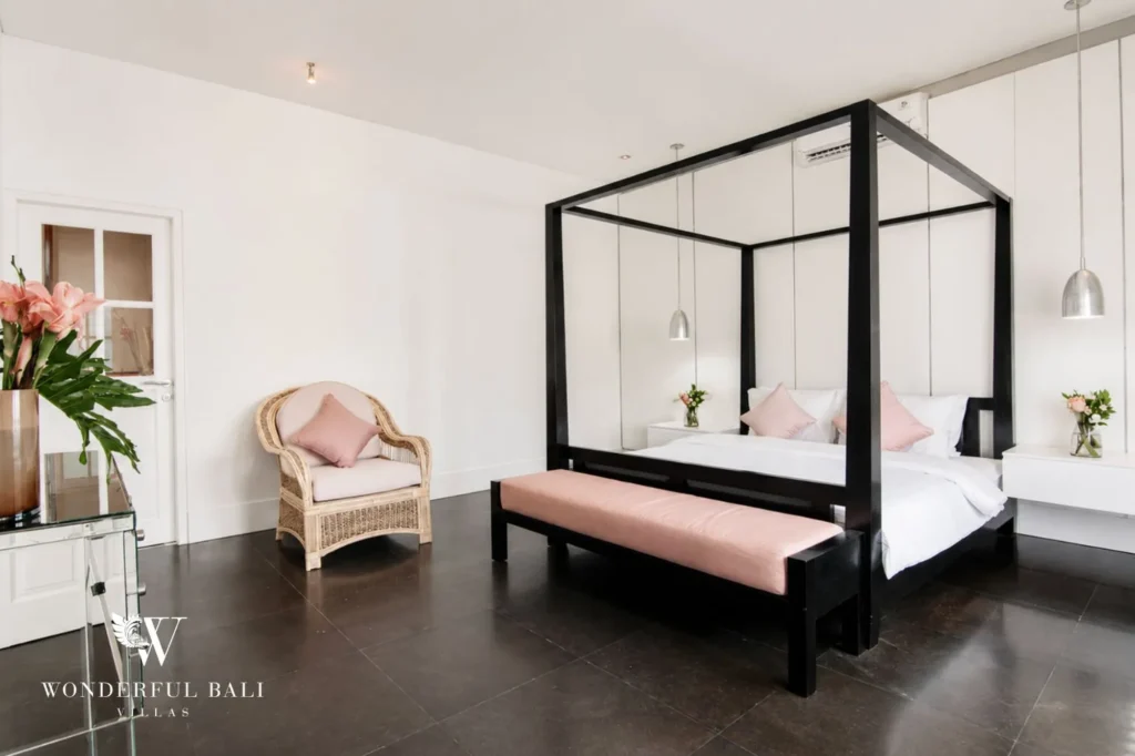 Bedroom with four-poster bed and traditional finishes, 3-bedroom colonial villa in Umalas
